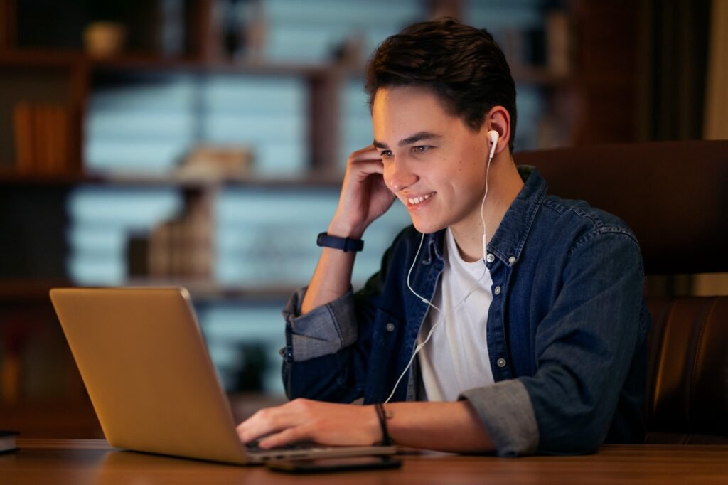 Young man project manager have online meeting late at night